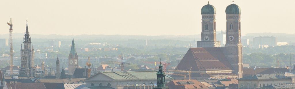 a city with cranes and buildings